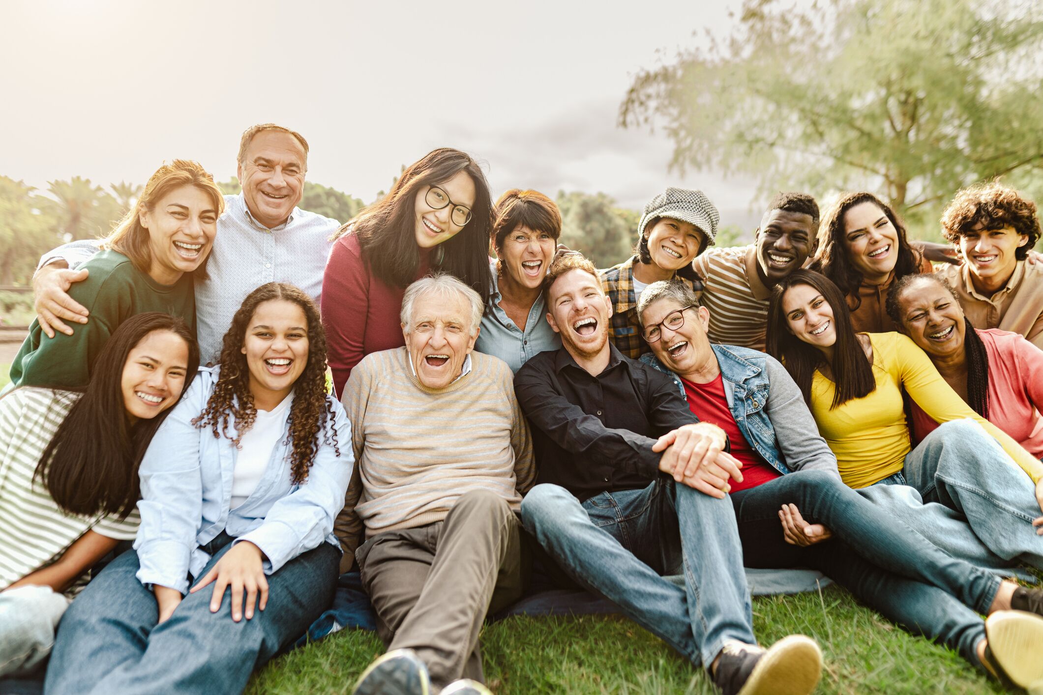Happy Senior celebrating a family get together at the park, symbolizing the peace of mind that comes with MetroPlusHealth's Medicare Platinum Plan.