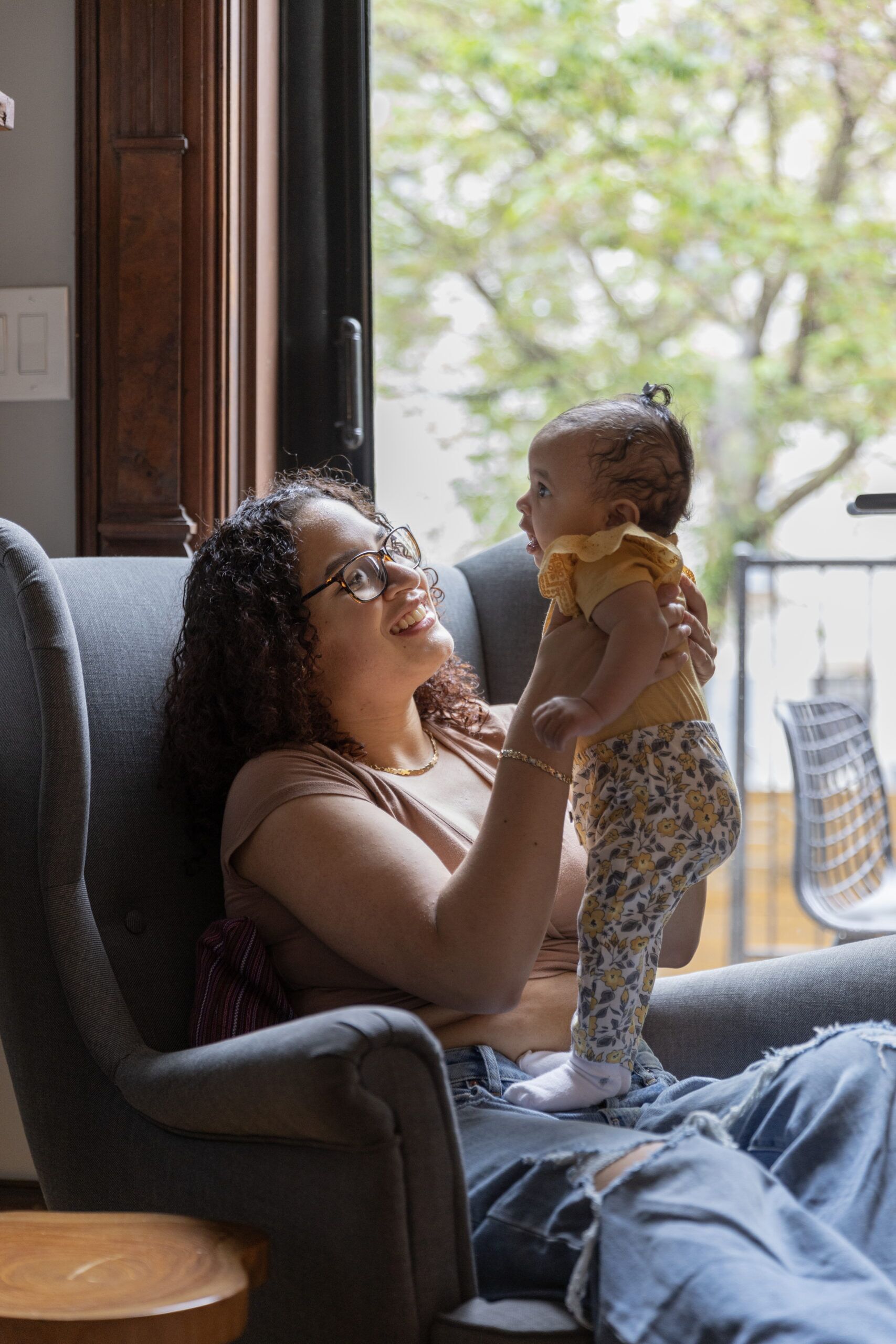 Smiling familiy at home enjoying peace of mind with MetroPlusHealth's Medicaid Managed Care Plan