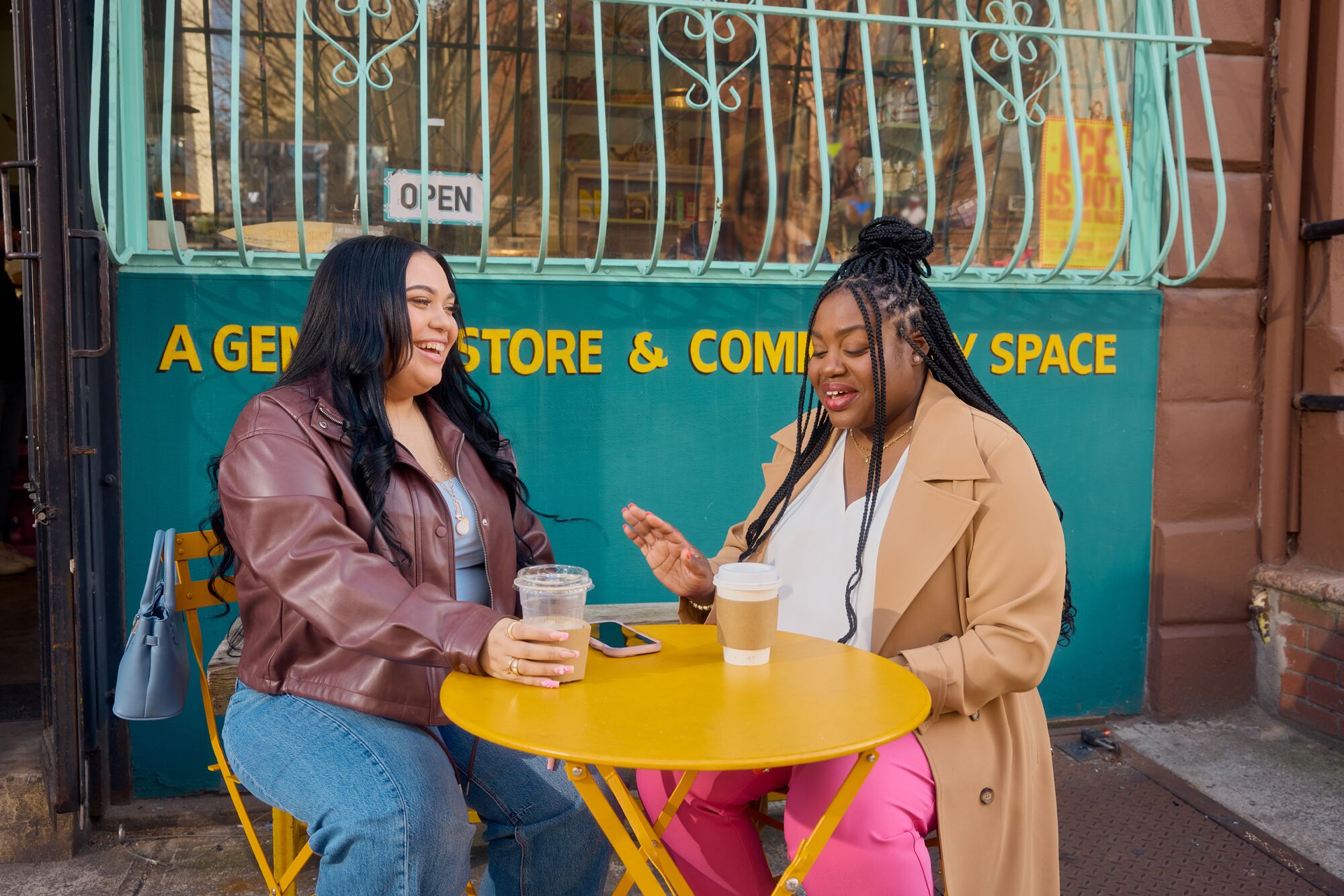 mph-women-sitting-at-yellow-table